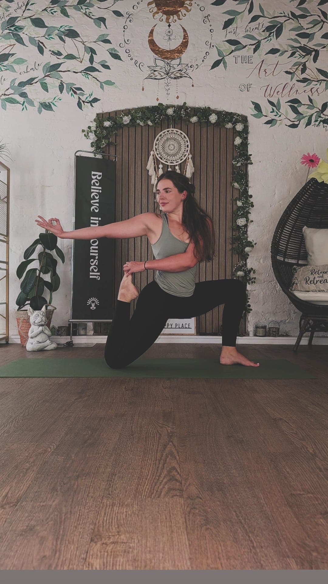 Han balancing on the mat in front of the painted wall